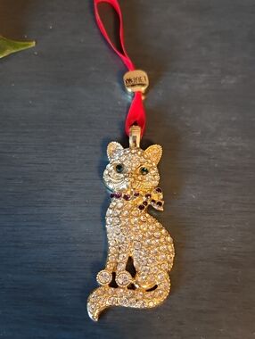 Monet Blingy Gold Cat Ornament with Red Ribbon and Green Eyes